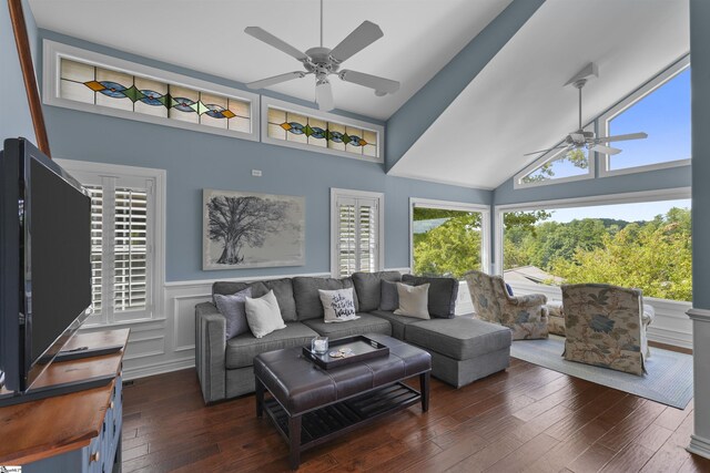 living room featuring high vaulted ceiling, ceiling fan, and dark wood-type flooring