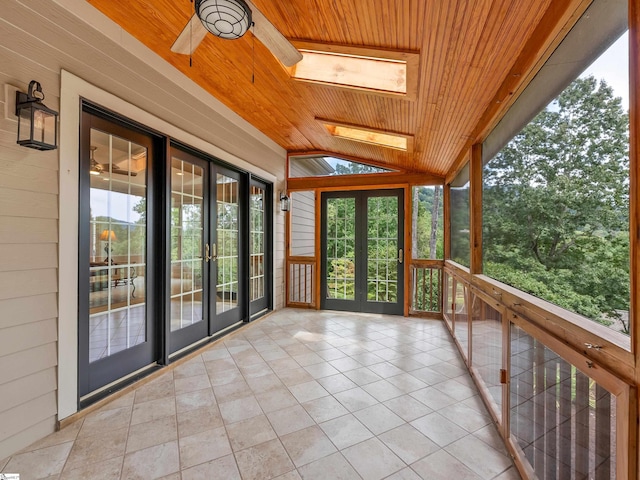 unfurnished sunroom with french doors, ceiling fan, vaulted ceiling, and wooden ceiling