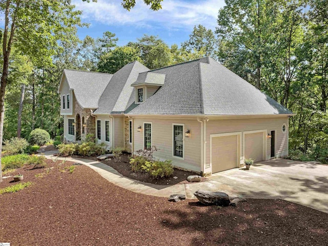 cape cod house featuring a garage