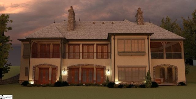 view of front of home with a sunroom