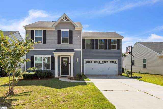 view of front of home featuring a garage and a front yard