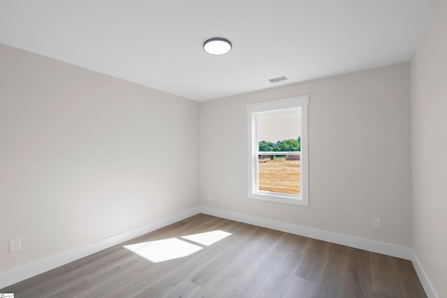 empty room with wood-type flooring