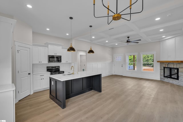 103 Leon Dr, Anderson, SC 29621 - kitchen featuring appliances with stainless steel finishes, coffered ceiling, light countertops, white cabinets, and recessed lighting