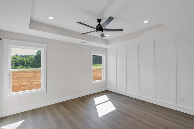 103 Leon Dr, Anderson, SC 29621 - empty room with plenty of natural light, a tray ceiling, wood finished floors, ceiling fan, and recessed lighting
