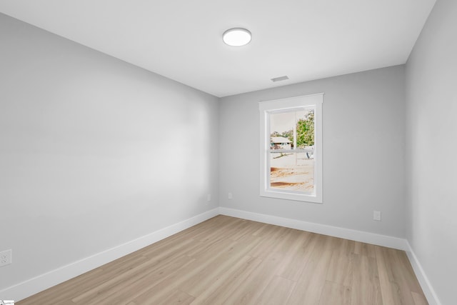 spare room with light hardwood / wood-style floors