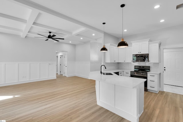 kitchen featuring coffered ceiling, backsplash, appliances with stainless steel finishes, ceiling fan, and white cabinets