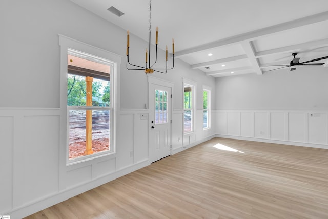 entrance foyer featuring ceiling fan with notable chandelier, beamed ceiling, coffered ceiling, and light hardwood / wood-style floors