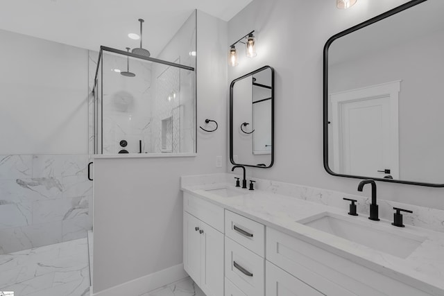 bathroom featuring walk in shower and vanity