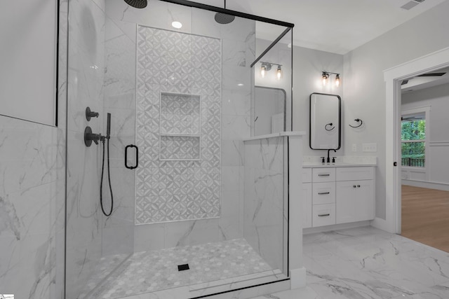 bathroom with hardwood / wood-style floors, an enclosed shower, and vanity