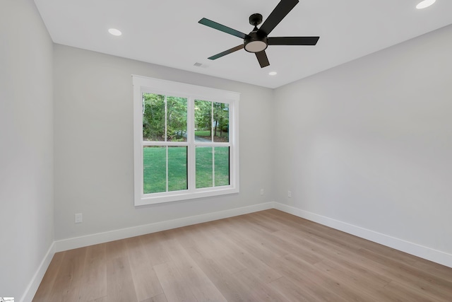 unfurnished room featuring light hardwood / wood-style flooring and ceiling fan