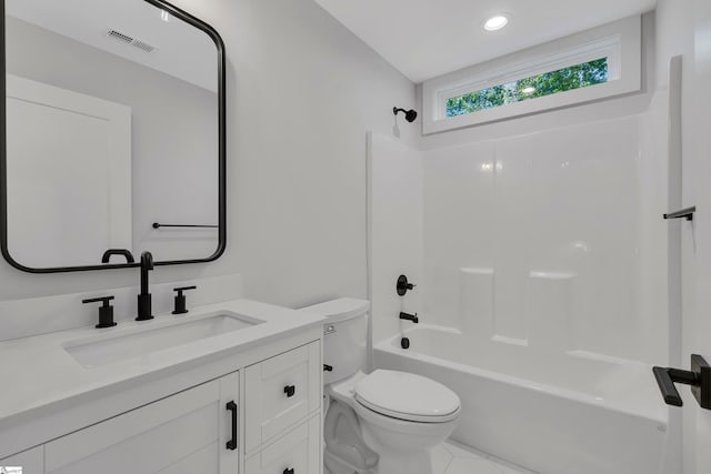 full bathroom featuring tile patterned floors, toilet, bathing tub / shower combination, and vanity