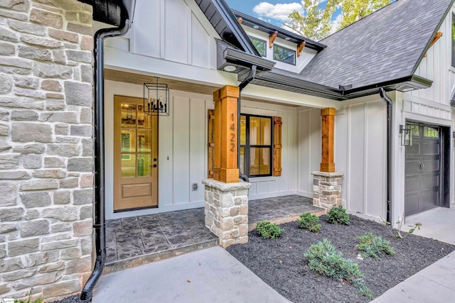 entrance to property with a garage and covered porch