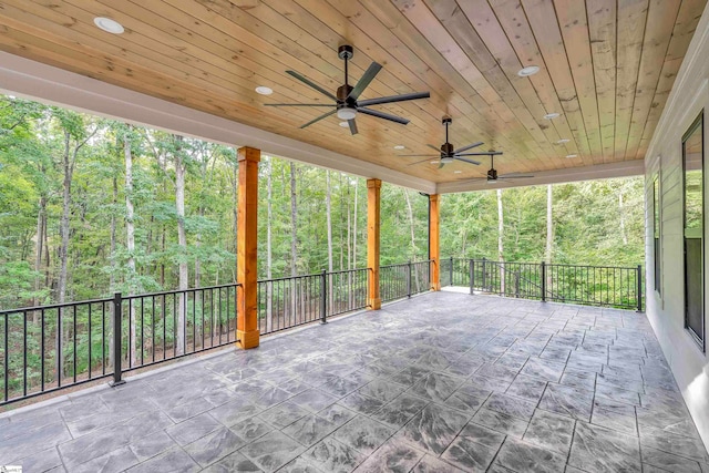 view of patio featuring ceiling fan and a balcony