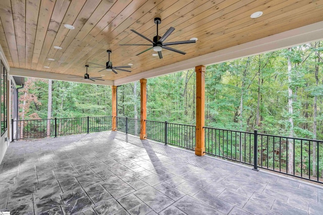 view of patio / terrace with ceiling fan and a balcony