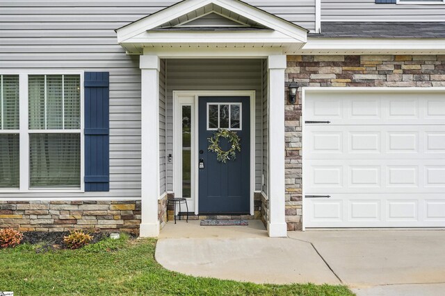 property entrance with a garage