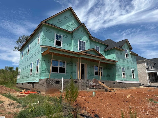 unfinished property with covered porch