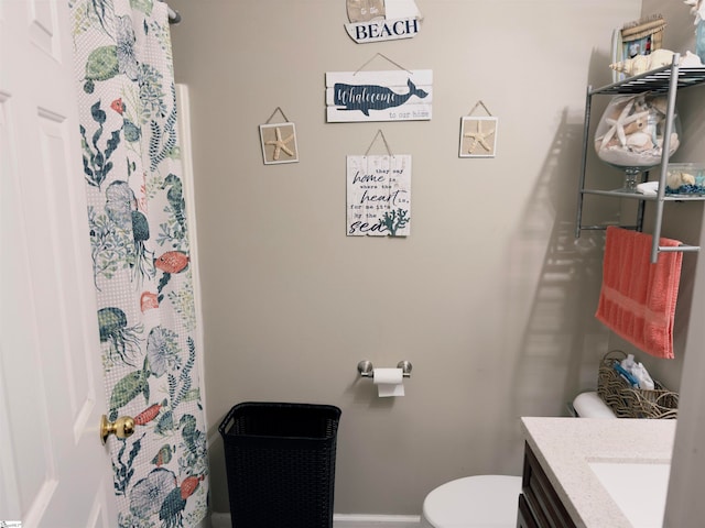 bathroom featuring vanity and toilet