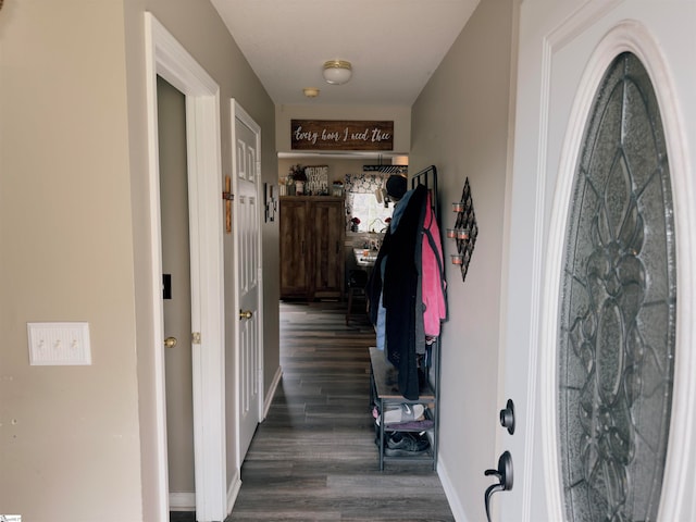 corridor with dark wood-type flooring