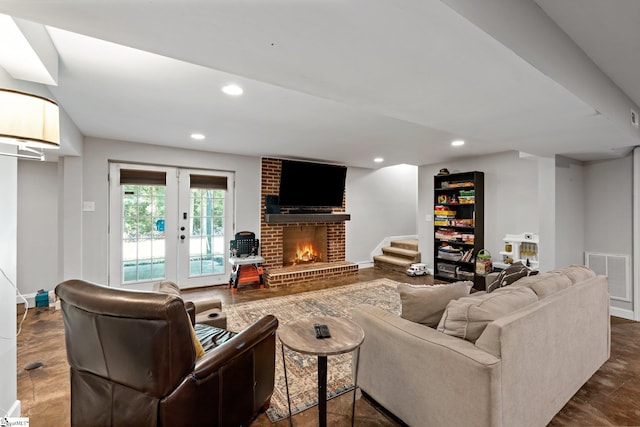 living room with a fireplace and french doors