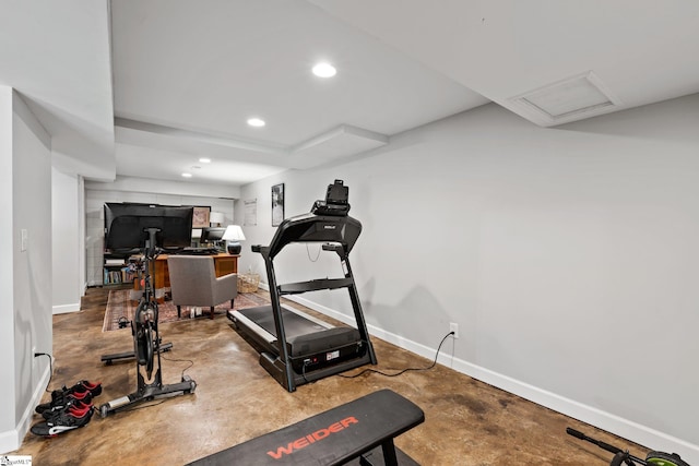 workout room featuring concrete floors