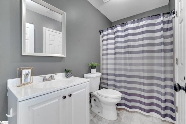 bathroom featuring tile patterned floors, walk in shower, toilet, and vanity