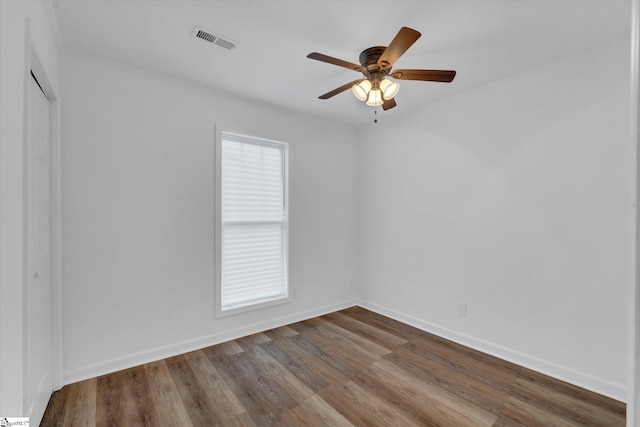 empty room featuring ceiling fan and wood-type flooring