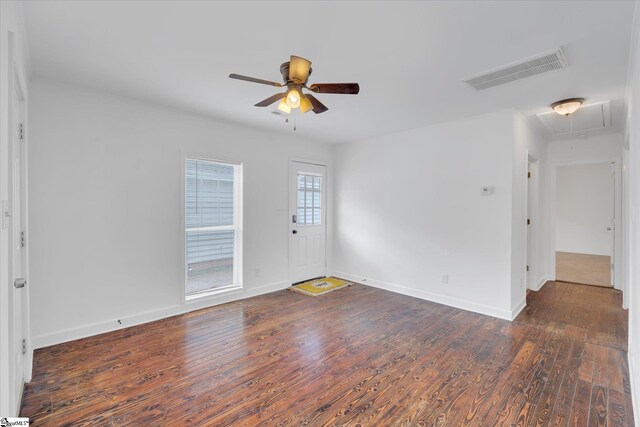 unfurnished room featuring dark wood-type flooring and ceiling fan