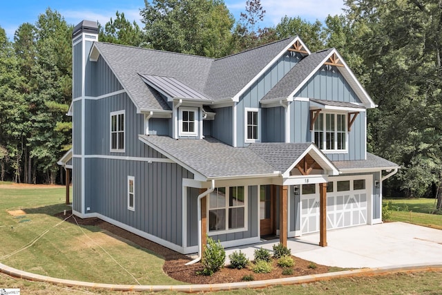 view of front of property featuring a garage and a front lawn