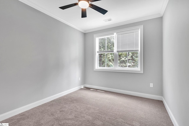 empty room featuring ornamental molding, ceiling fan, and carpet flooring