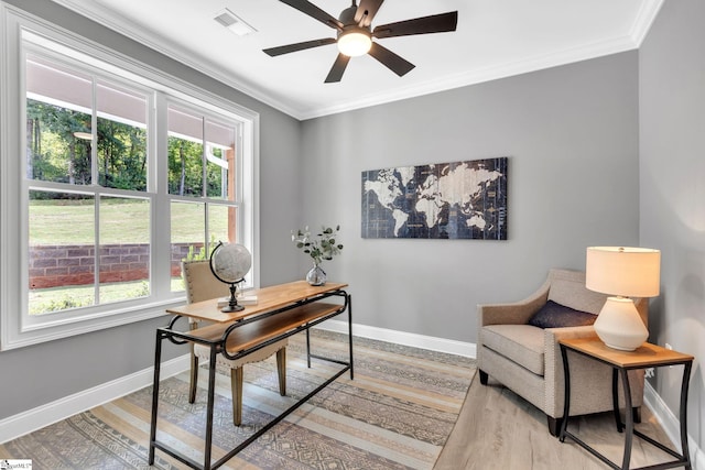 office space featuring crown molding, hardwood / wood-style floors, and ceiling fan