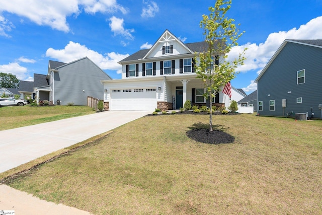 view of front of home with a garage, covered porch, central AC unit, and a front lawn