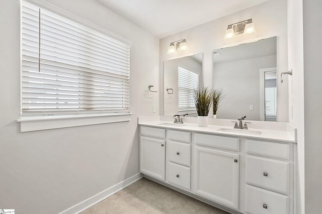 bathroom featuring tile patterned flooring and vanity