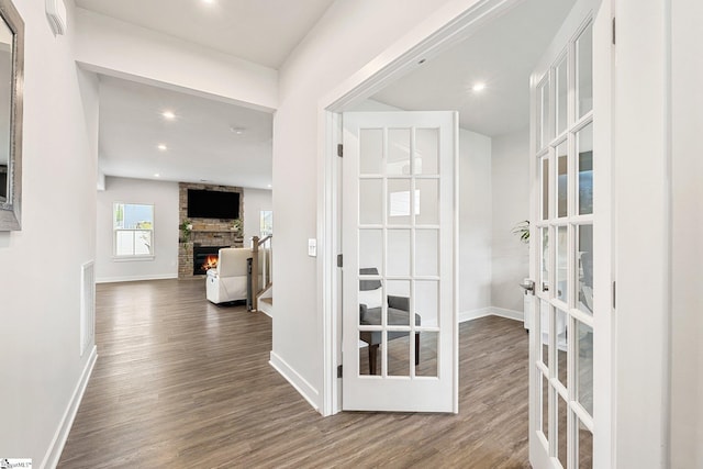 hallway featuring french doors and dark hardwood / wood-style flooring