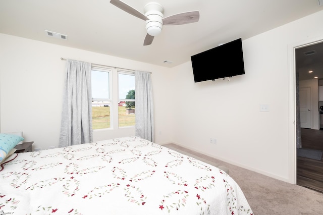 carpeted bedroom with ceiling fan