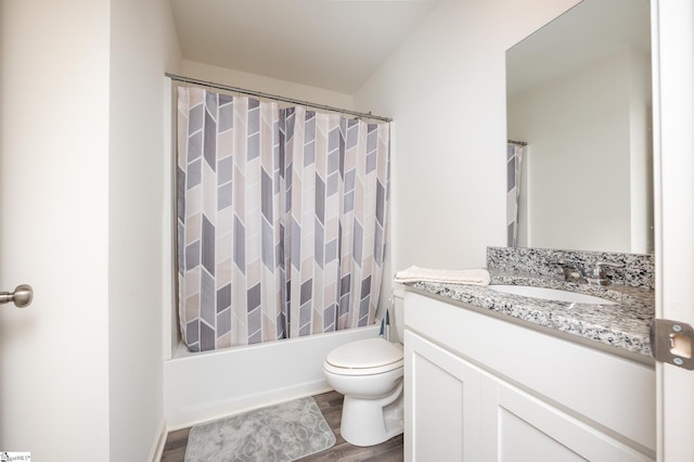 full bathroom featuring shower / bathtub combination with curtain, hardwood / wood-style floors, toilet, and vanity