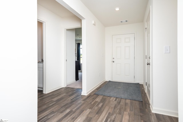 foyer with dark hardwood / wood-style flooring