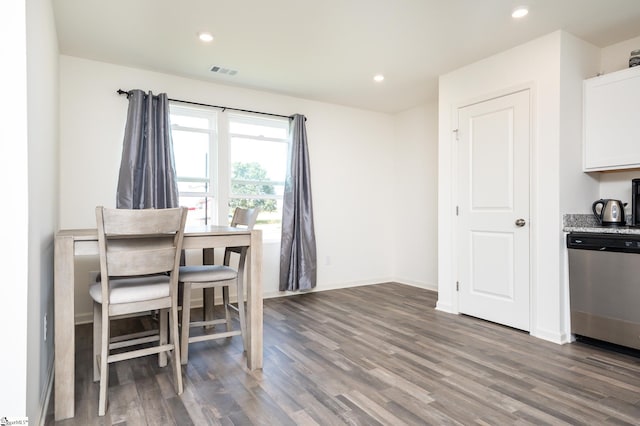 dining space with dark wood-type flooring