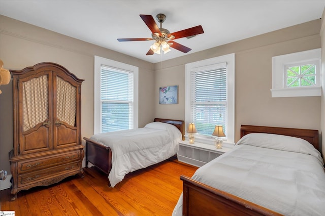 bedroom featuring hardwood / wood-style flooring and ceiling fan