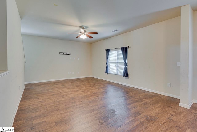 unfurnished room with hardwood / wood-style floors and ceiling fan