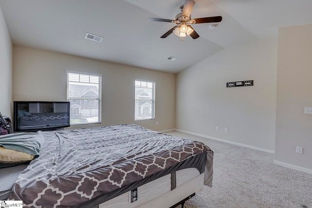 bedroom featuring lofted ceiling, ceiling fan, and light carpet