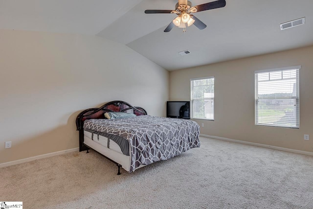 carpeted bedroom with lofted ceiling and ceiling fan