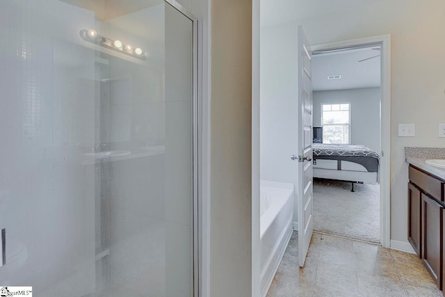 bathroom featuring vanity and separate shower and tub