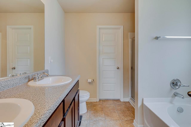 full bathroom featuring vanity, toilet, and independent shower and bath