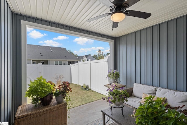 view of patio / terrace with ceiling fan and an outdoor living space