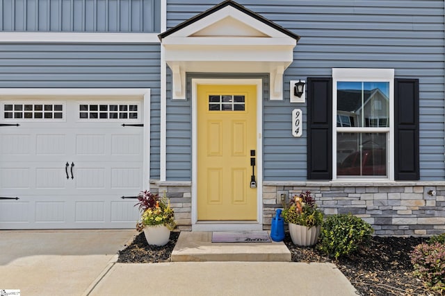 doorway to property featuring a garage