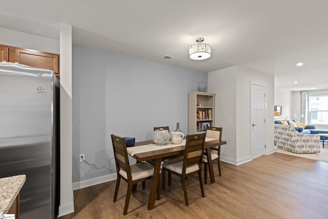 dining room with light wood-type flooring