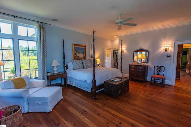 bedroom with ceiling fan, dark hardwood / wood-style flooring, and ornamental molding