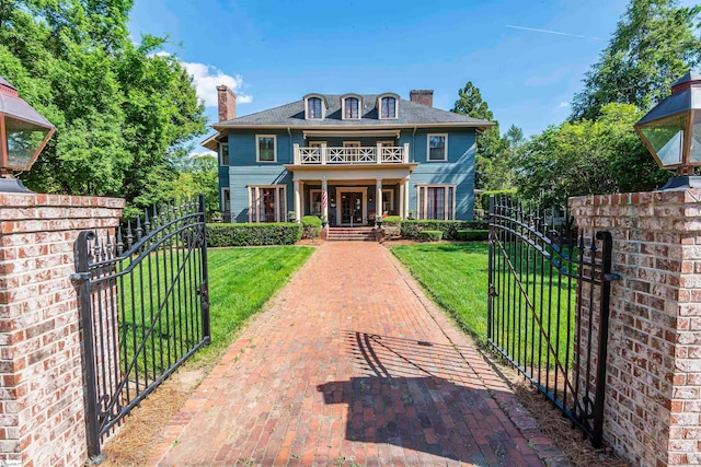 view of front of home with a front lawn and covered porch