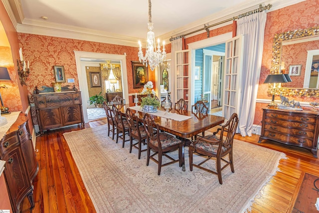 571 E Main St, Spartanburg, SC 29302 - dining area featuring wallpapered walls, hardwood / wood-style floors, a chandelier, and ornamental molding
