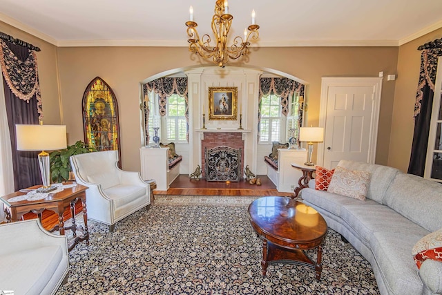 571 E Main St, Spartanburg, SC 29302 - living area featuring arched walkways, a chandelier, crown molding, wood finished floors, and a fireplace